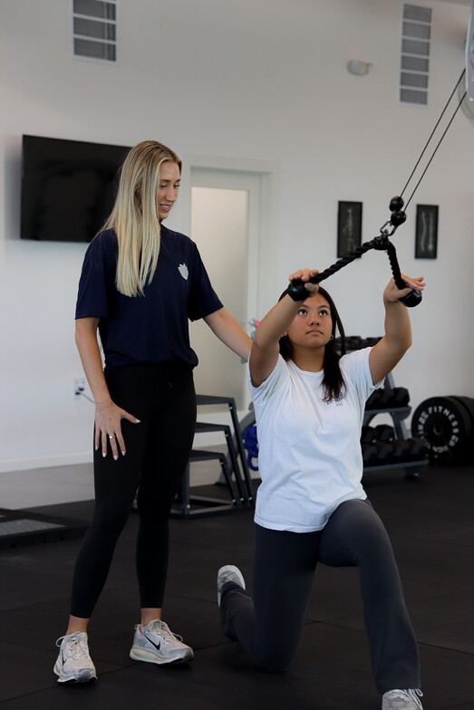 Athlete performing a functional movement test during a physical therapy session